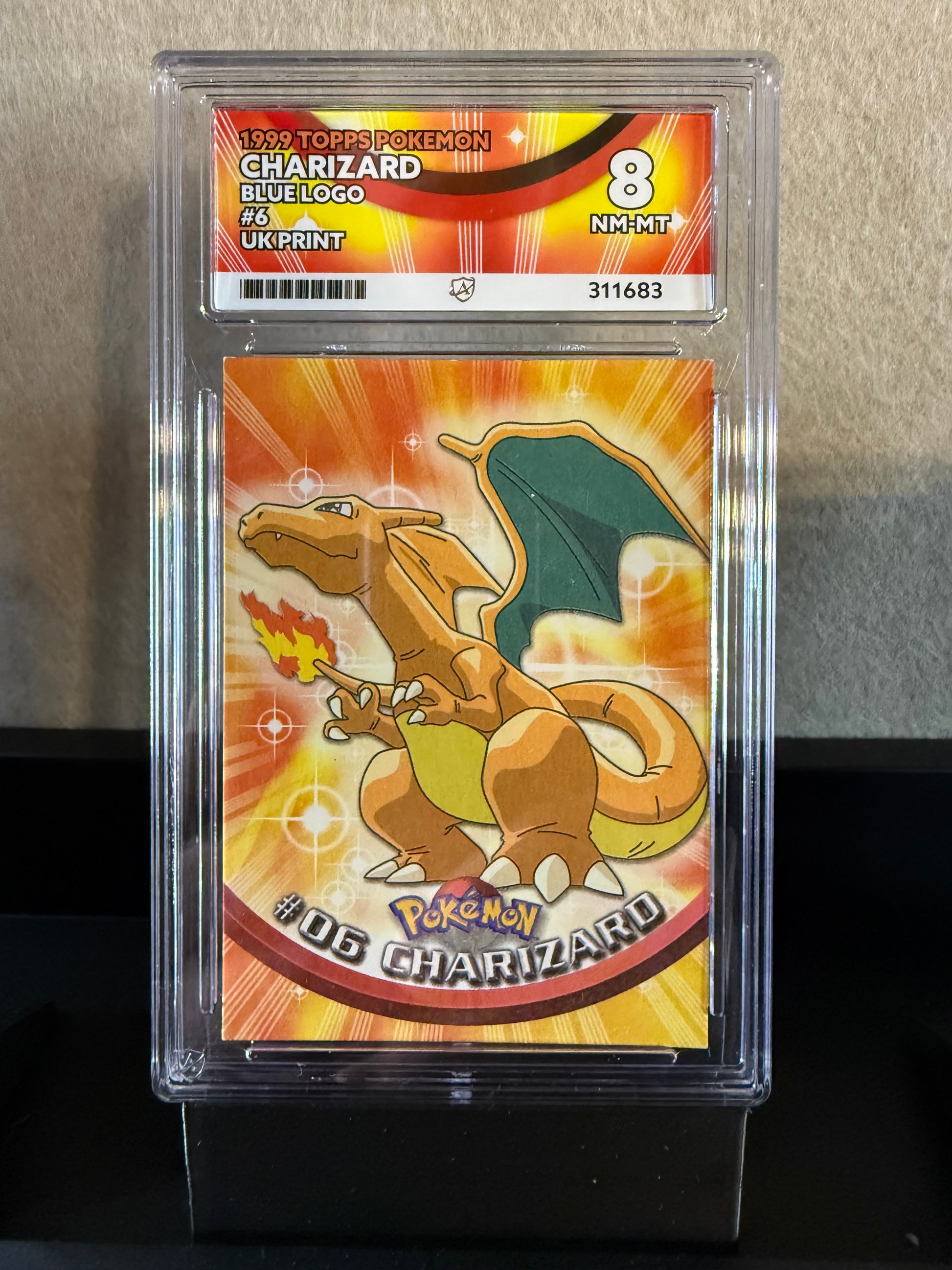 1999 Topps Pokémon Charizard #6 (Blue Logo, UK Print) – Graded 8 NM-MT
